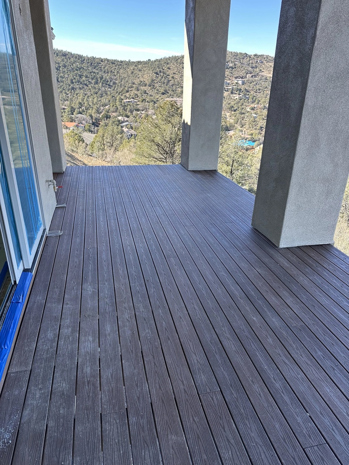 A Redeemed Builders deck looking out over pine-covered hills