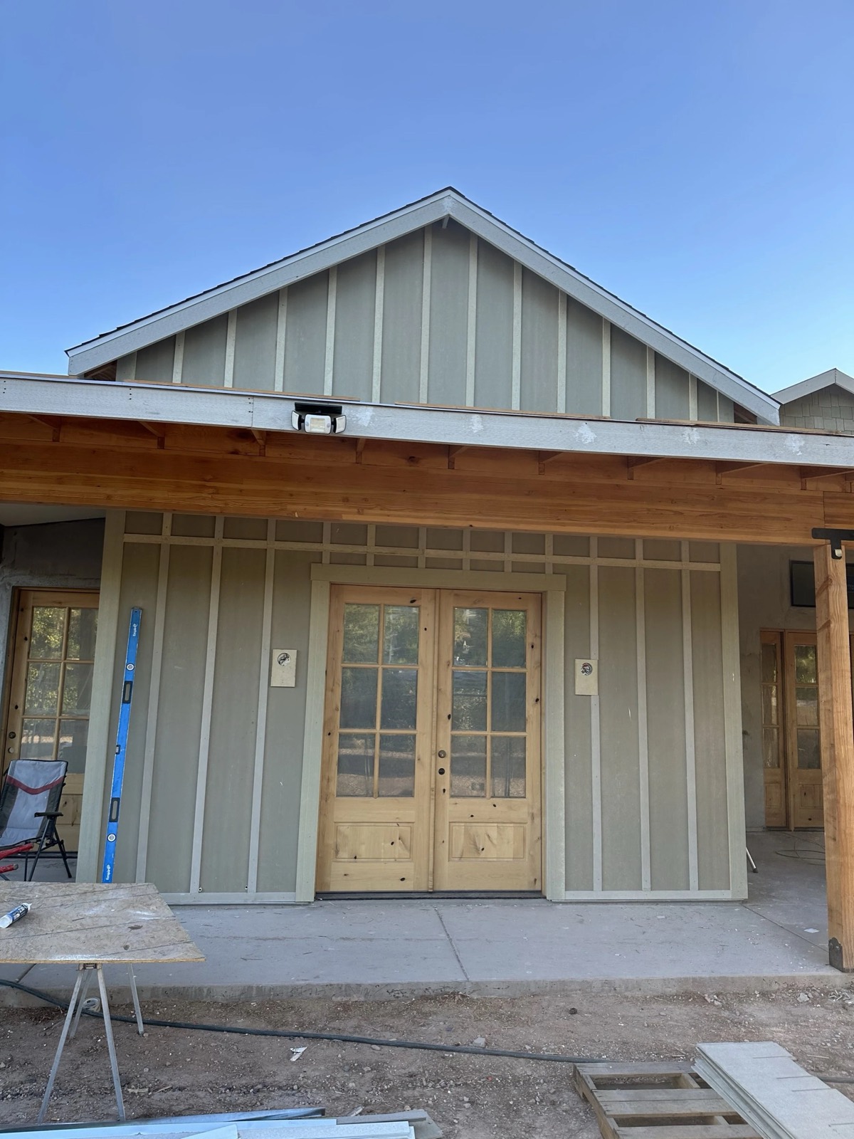 Board-and-batten gable over double French doors