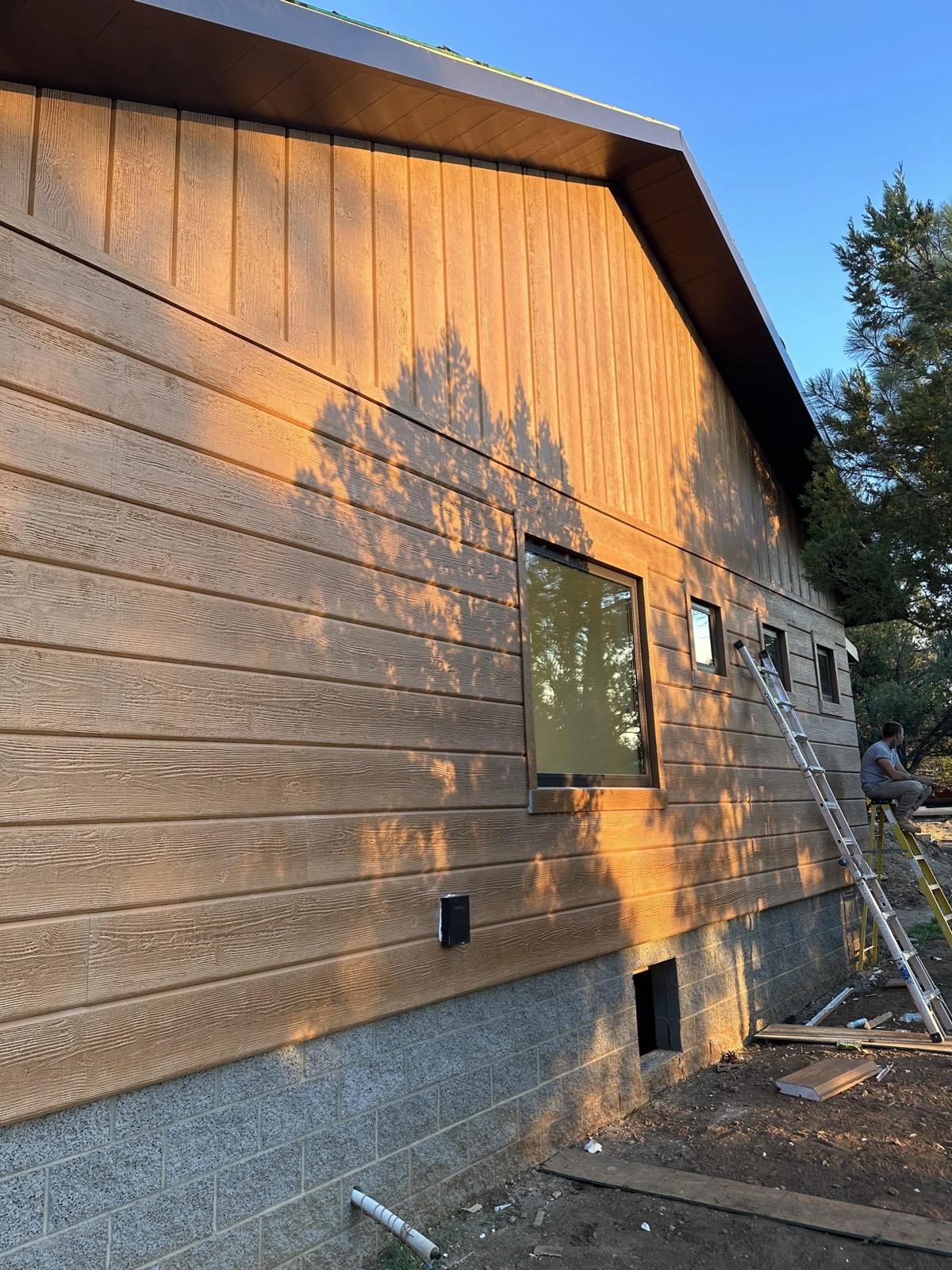 Lap siding on a Redeemed Builders job in low afternoon sun
